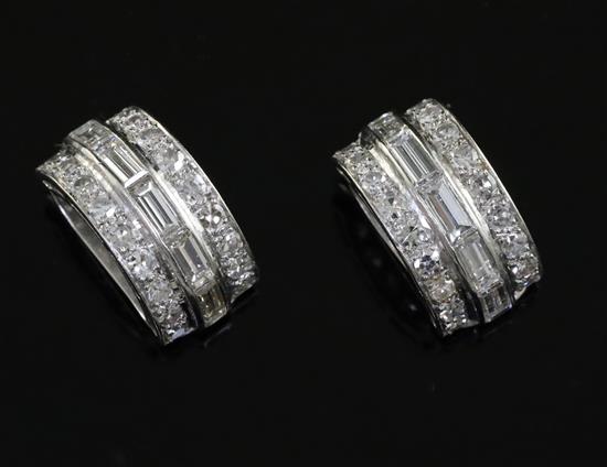A pair of platinum?, baguette and round cut diamond set demi-lune ear clips, 15mm.